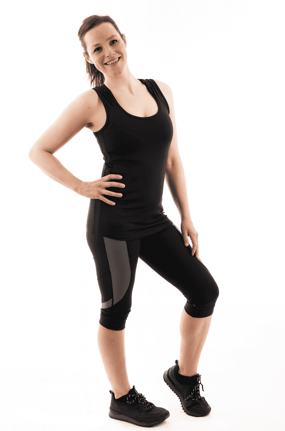 Maternity fitness outfit featuring FittaMamma pregnancy activewear top and leggings, perfect for stylish prenatal workouts.